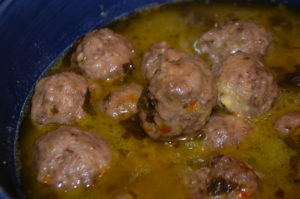 Balls of meat in a light brown sauce